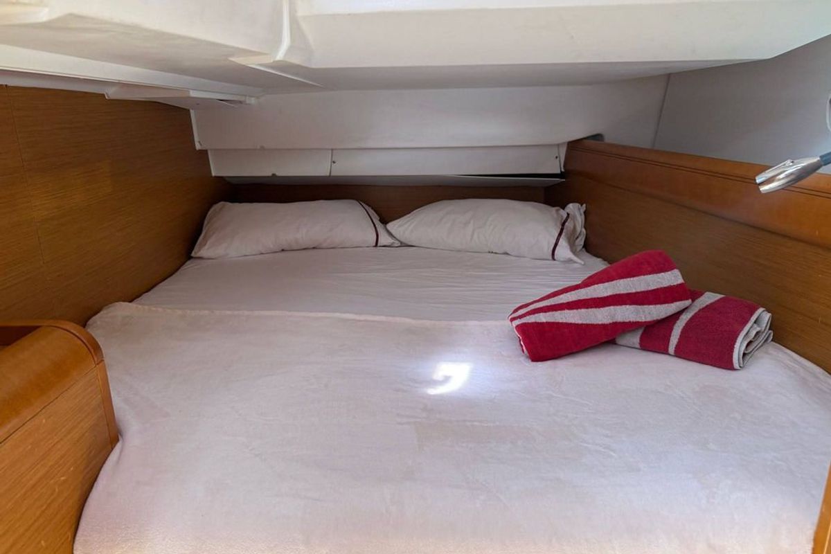 Cabin on Mientras Tanto, a Jeanneau Sun Odyssey 449 sailboat at Ibiza, Spain