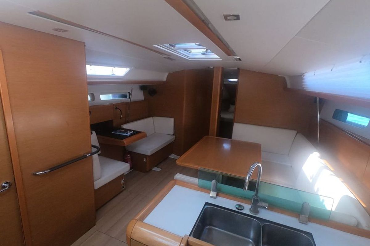 Salon of Mientras Tanto, a Jeanneau Sun Odyssey 449 sailboat at Ibiza, Spain