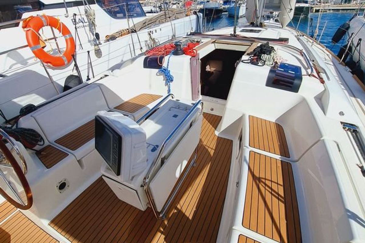 Exterior view of Mientras Tanto, a Jeanneau Sun Odyssey 449 sailboat at Ibiza, Spain