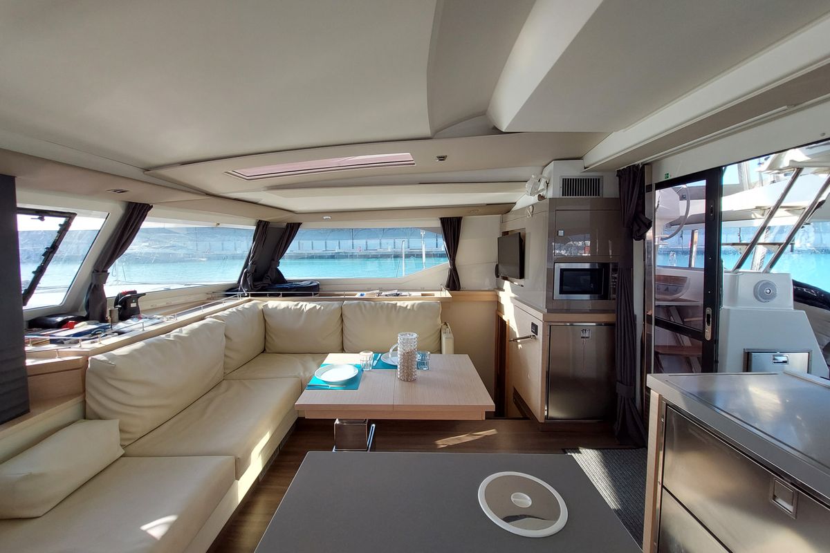 Salon of Ancora Reha, a Fountaine Pajot Saona 47 catamaran at Rosignano Solvay, Italy