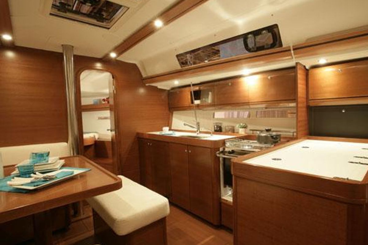 Salon of Chioggia Minuddaa, a Dufour 405 sailboat at U Pàize/Carloforte, Italy