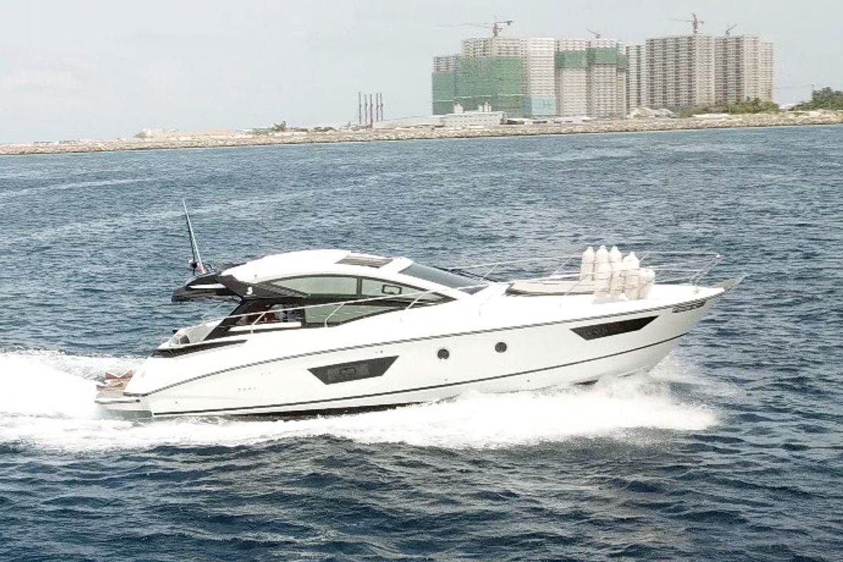 Exterior view of Island Cruise, a Beneteau GT40 motorboat at Malé, Maldives