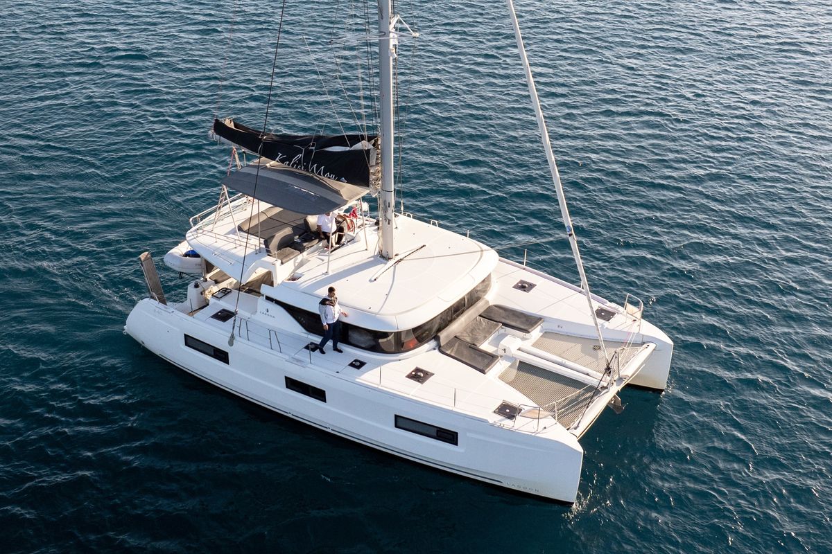Exterior view of Kalisi Mou, a Lagoon 46 catamaran at Parikia, Greece