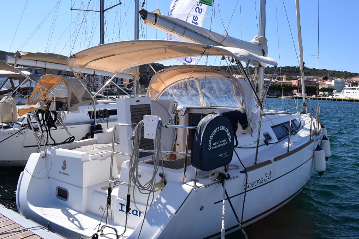 Exterior view of Izar, a Beneteau Oceanis 34 sailboat at U Pàize/Carloforte, Italy