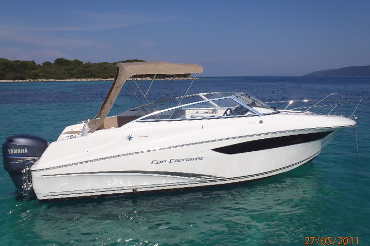 Exterior view of Cap Camarat, a Jeanneau Cap Camarat 7.5 CC motorboat at Sitges, Spain