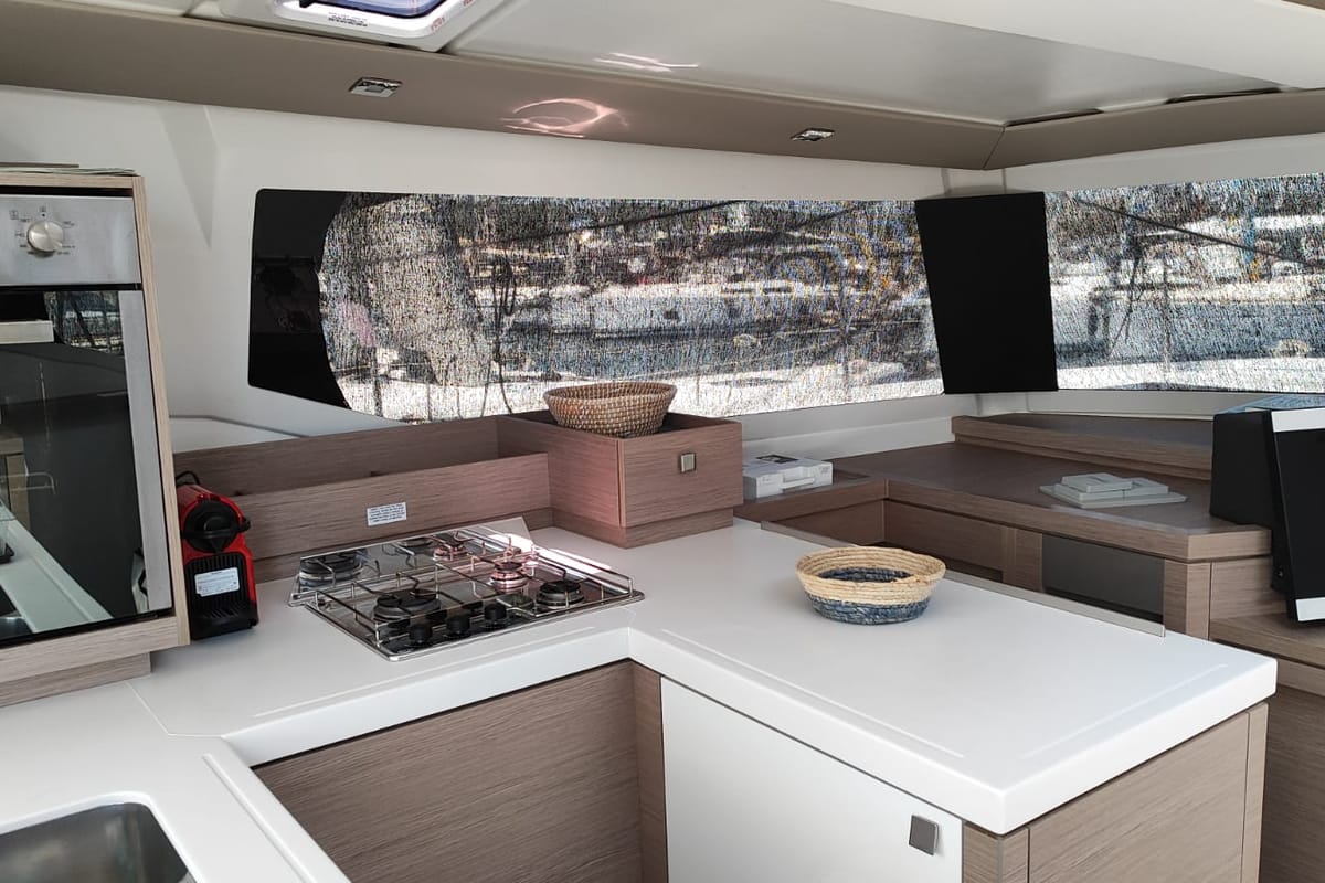 Cicada, a Fountaine Pajot Astrea 42 catamaran at Lavreotiki Municipal Unit, Greece