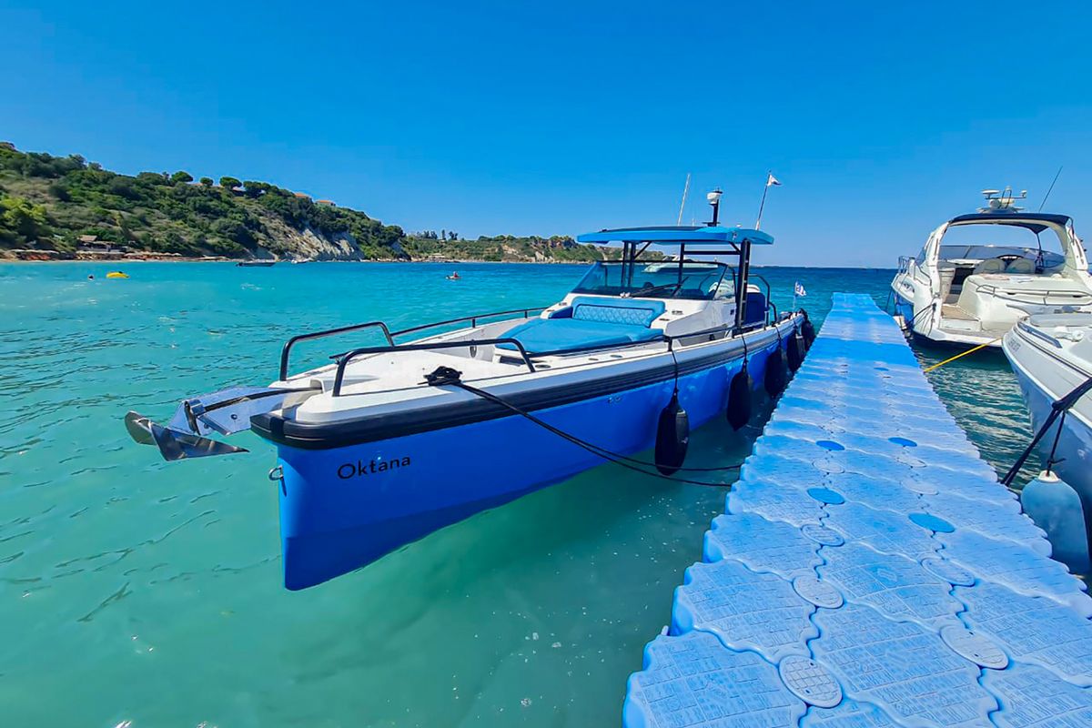 Exterior view of Oktana, a Axopar 37  Sun Top motorboat at Gouvia, Greece