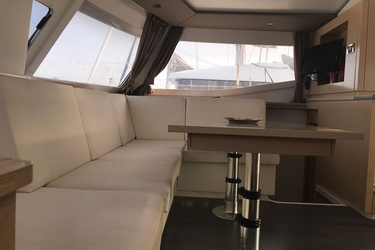 Salon of Pixie Dixie, a Fountaine Pajot Helia 44 catamaran at Olbia, Italy