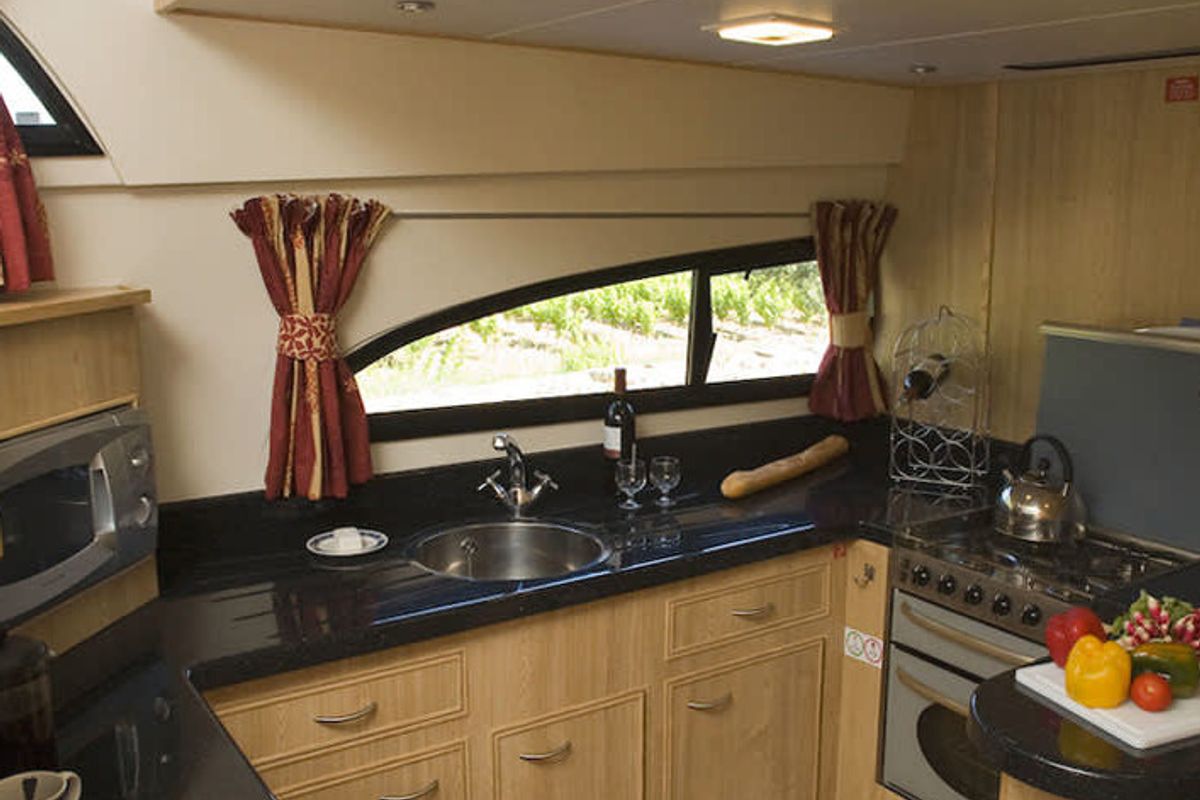 Galley of Royal Mystique A, a Cygnet Royal Mystique motorboat at Fontenoy-le-Château, France