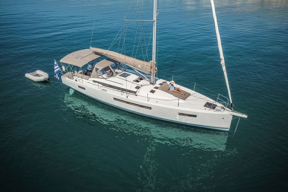 Exterior view of Mad Kiss, a Jeanneau Sun Odyssey 490 sailboat at Lavreotiki Municipal Unit, Greece