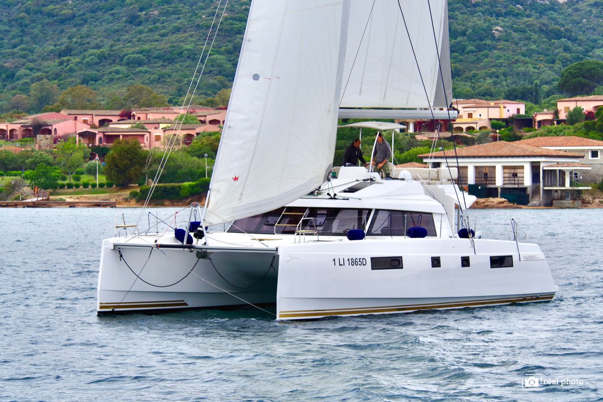 Exterior view of Fiammetta, a Nautitech 46 Fly catamaran at Cannigione, Italy