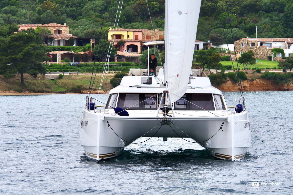 Exterior view of Fiammetta, a Nautitech 46 Fly catamaran at Cannigione, Italy