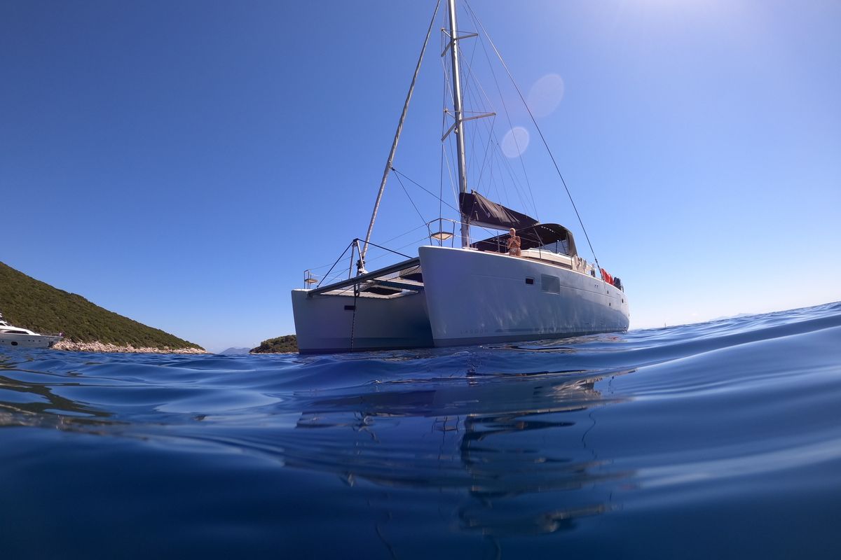Exterior view of EVI, a Lagoon 450 F catamaran at Kontokali, Greece