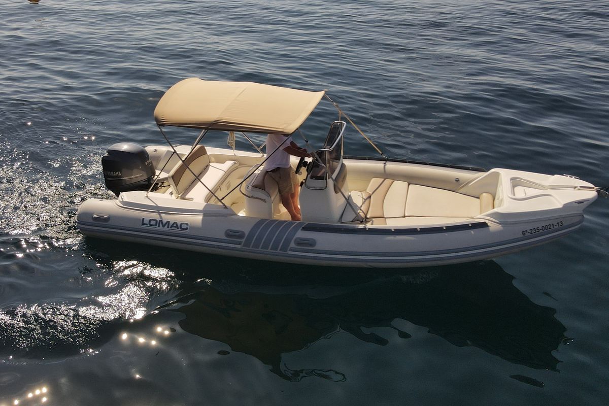 Exterior view of Fura, a Lomac Turismo 675 motorboat at Palamós, Spain