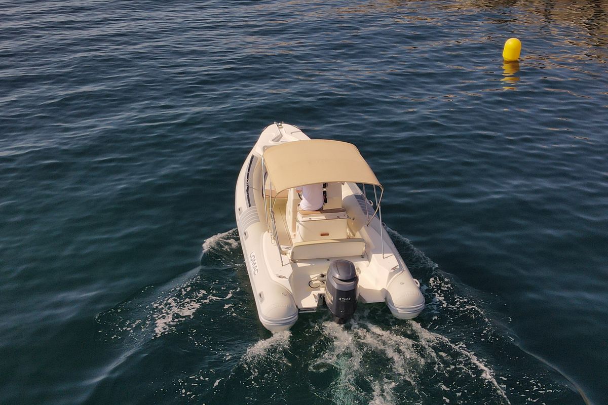 Exterior view of Fura, a Lomac Turismo 675 motorboat at Palamós, Spain
