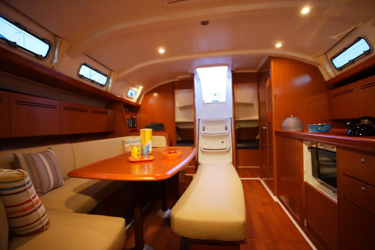 Salon of Via Col Vento, a Beneteau Cyclades 39.3 sailboat at Milazzo, Italy