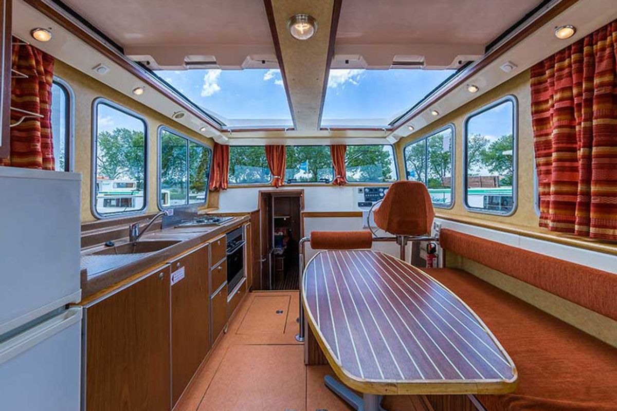 Salon of 1120R-6, a Pénichette 1120 motorboat at Scey-sur-Saône-et-Saint-Albin, France