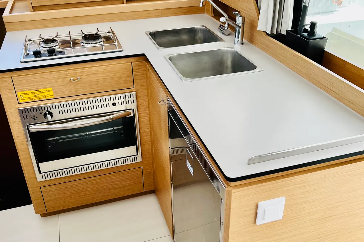 Galley of One Ibiza Crewed, a Excess 11 catamaran at Ibiza, Spain