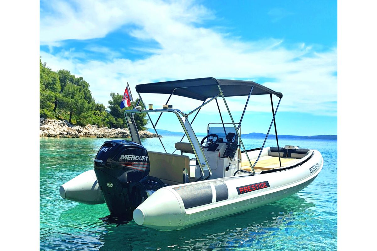Exterior view of Niky, a Prestige Ranger 600 motorboat at Grad Trogir, Croatia