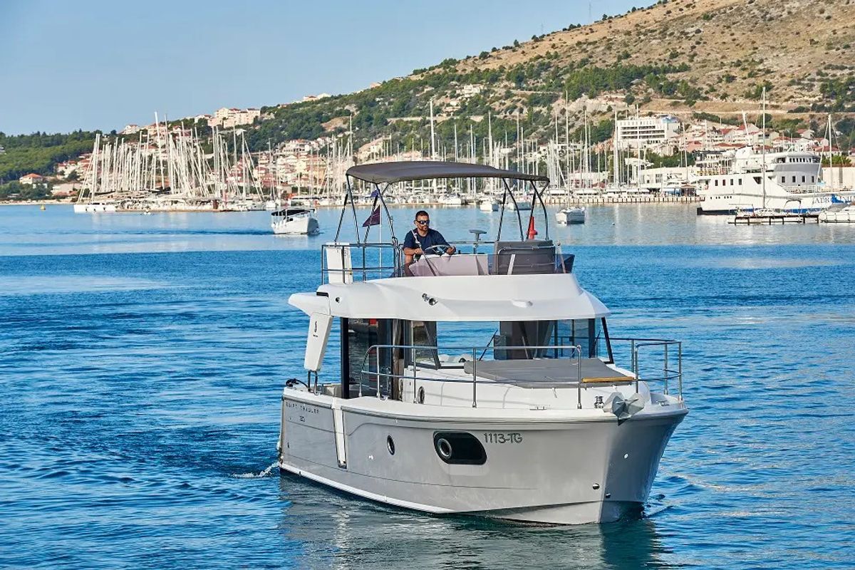 Exterior view of Odysseus, a Beneteau Swift Trawler 30 motorboat at Grad Trogir, Croatia