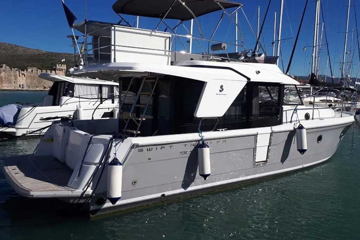 Exterior view of Odysseus, a Beneteau Swift Trawler 30 motorboat at Grad Trogir, Croatia