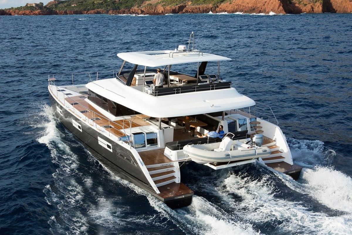 Exterior view of Pearly Gates, a Lagoon Power 630 catamaran at Mykonos, Greece