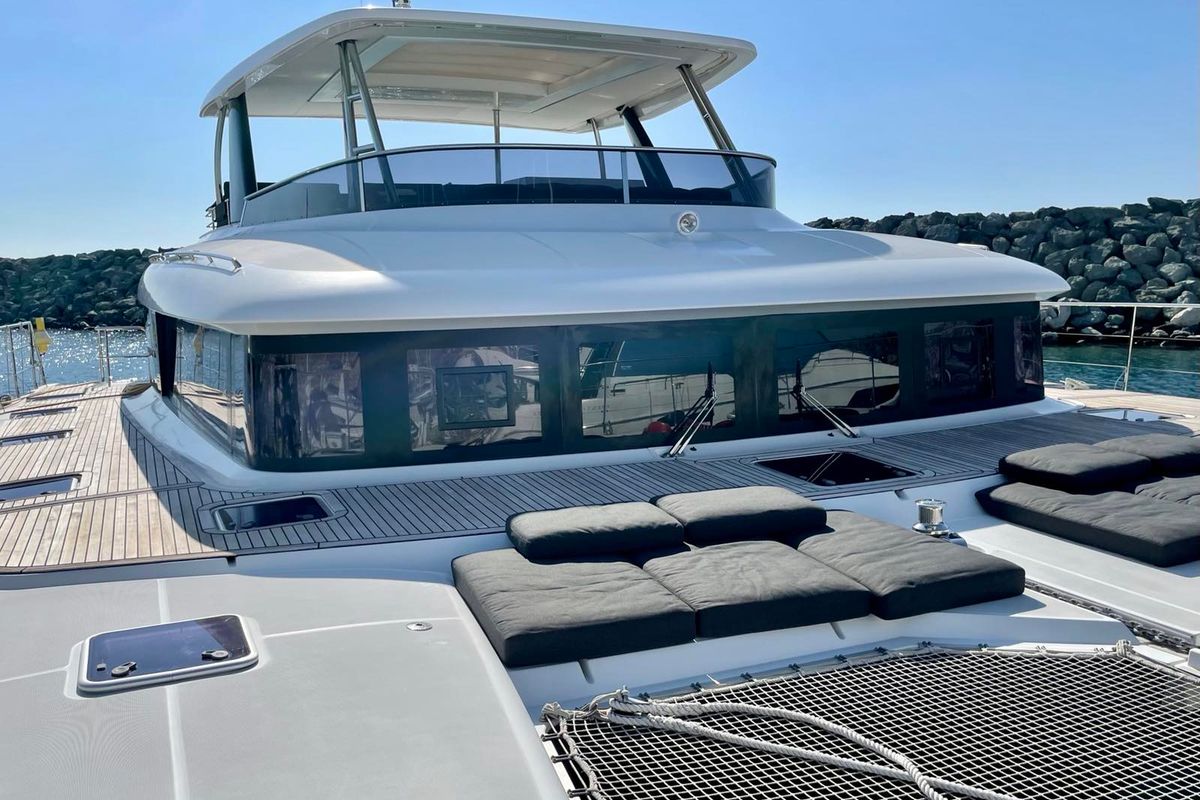 Exterior view of Pearly Gates, a Lagoon Power 630 catamaran at Mykonos, Greece
