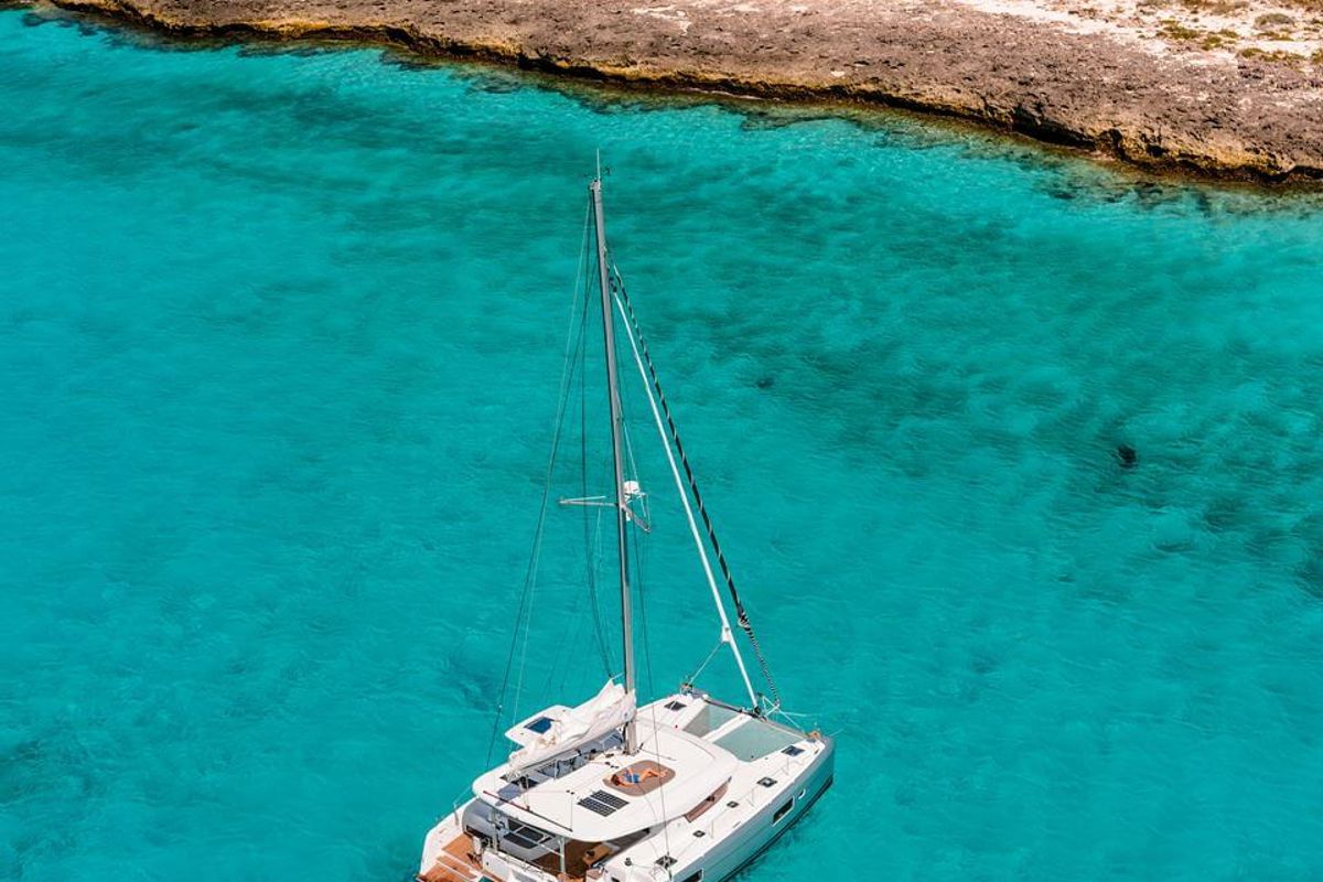 Exterior view of HeyBlue, a Lagoon 42 catamaran at Parikia, Greece