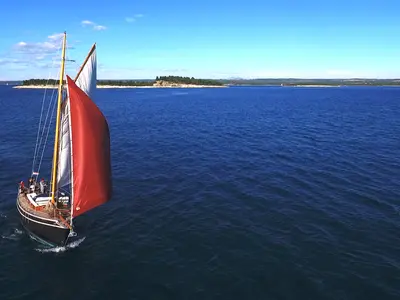 Exterior view of Black Bird, a Unknown Pilot Cutter sailboat at Grad Pula, Croatia