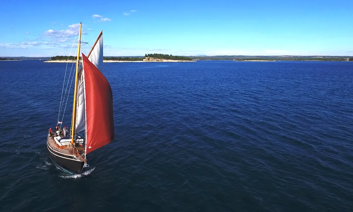Exterior view of Black Bird, a Unknown Pilot Cutter sailboat at Grad Pula, Croatia