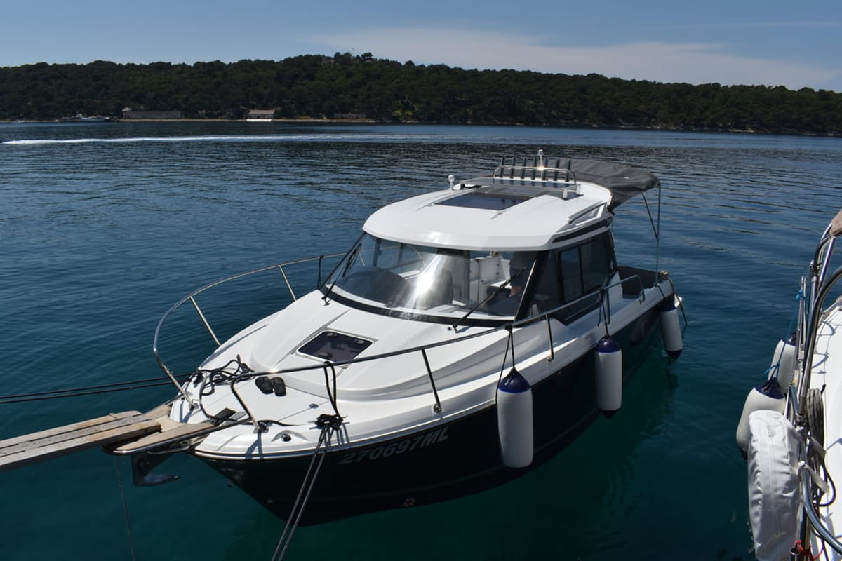 Exterior view of Posejdon, a Jeanneau Merry Fisher 795 motorboat at Mali Lošinj, Croatia