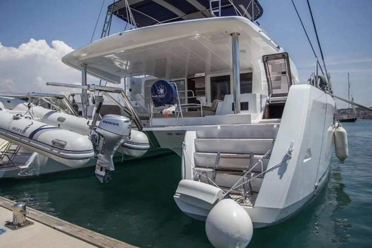 Exterior view of Jolie, a Lagoon 52F catamaran at Sant Antoni de Portmany, Spain
