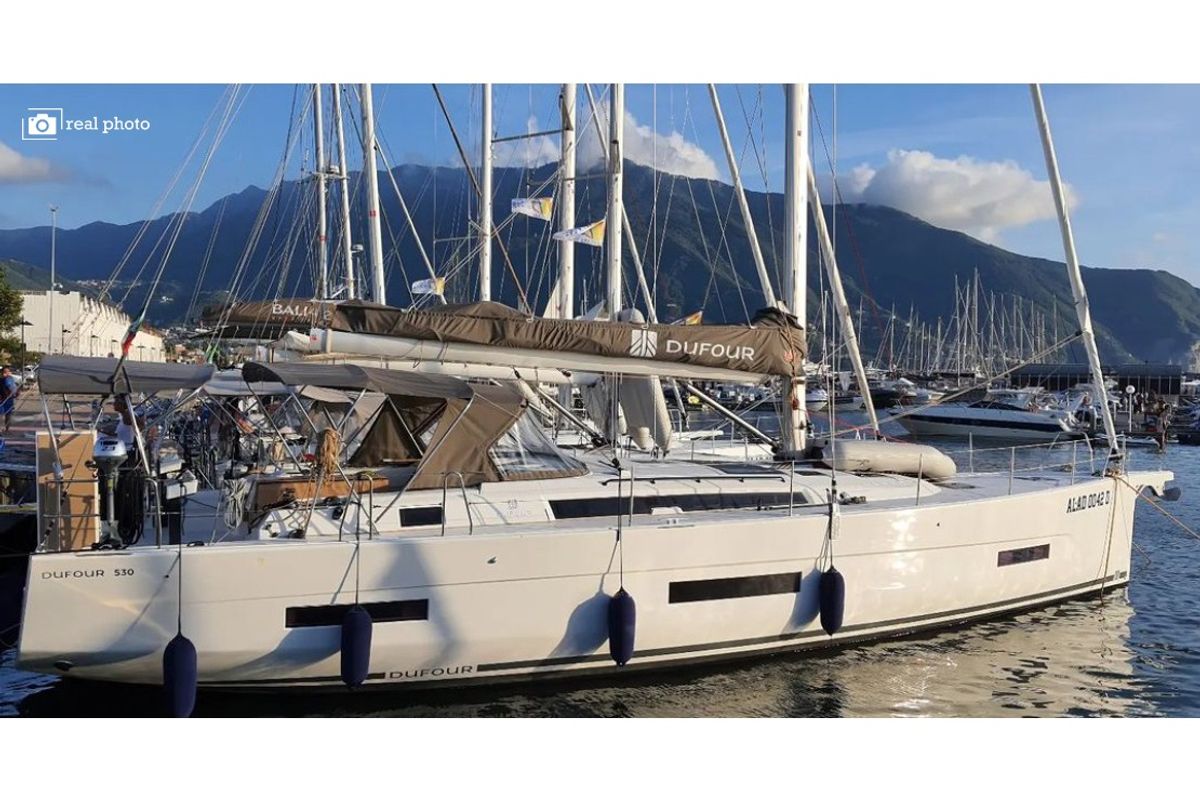Exterior view of Cassiopea - A/C, Generator, Water maker, Solar Panel, a Dufour 530 sailboat at Castellammare di Stabia, Ita…