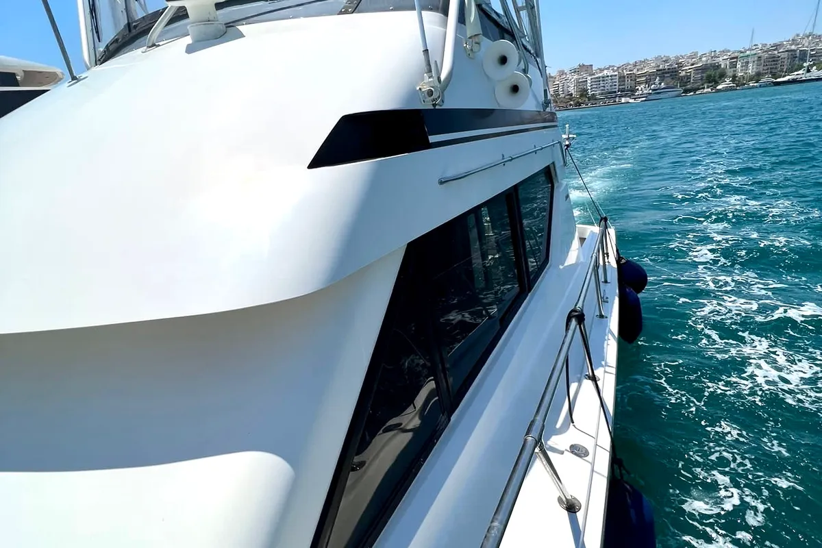 Exterior view of Tipejyas, a Gulet Hatteras 50 Convertible motorboat at Livadi, Greece