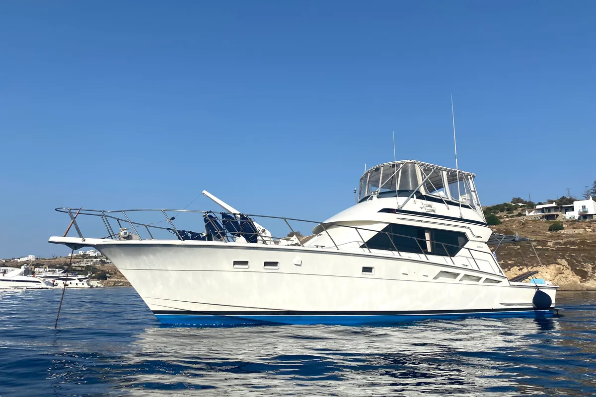 Exterior view of Tipejyas, a Gulet Hatteras 50 Convertible motorboat at Livadi, Greece