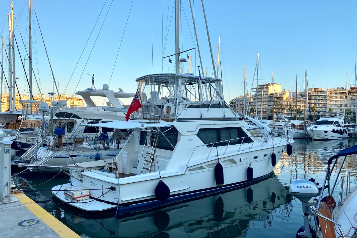 Exterior view of Tipejyas, a Gulet Hatteras 50 Convertible motorboat at Livadi, Greece