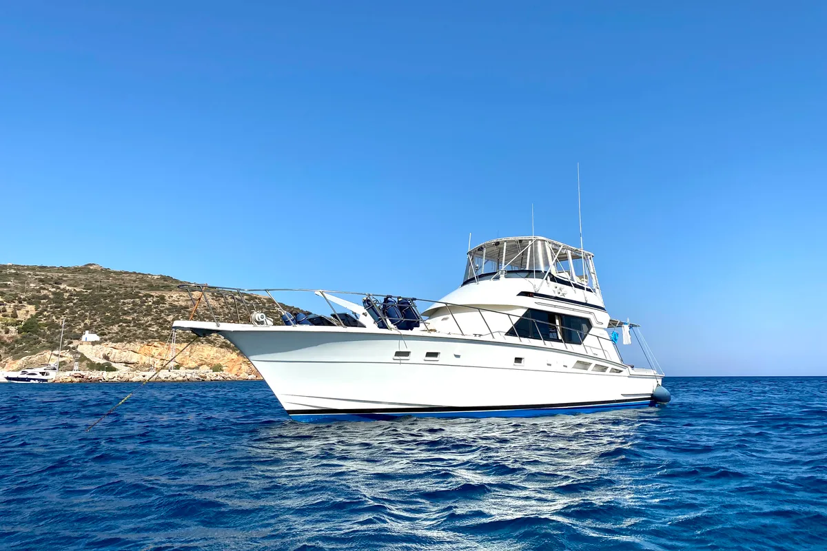 Exterior view of Tipejyas, a Gulet Hatteras 50 Convertible motorboat at Livadi, Greece