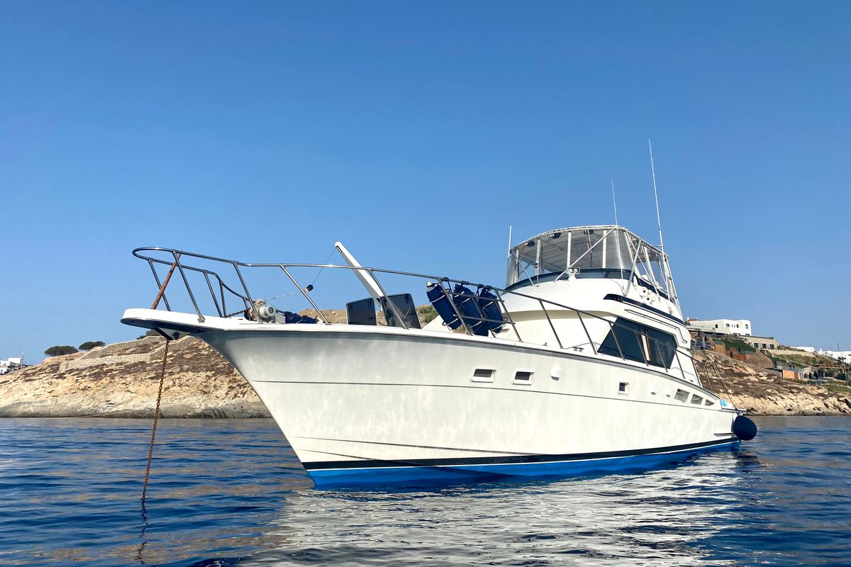 Exterior view of Tipejyas, a Gulet Hatteras 50 Convertible motorboat at Livadi, Greece